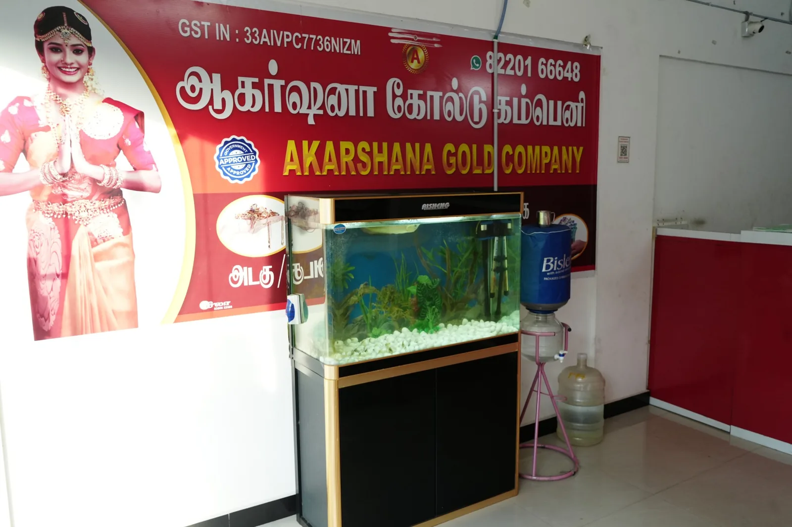 Akarshana Gold Company Pollachi branch signboard close-up